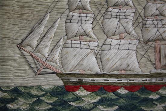 A Victorian woolwork ship picture depicting a frigate and lighthouse, 12.5 x 15.5in.